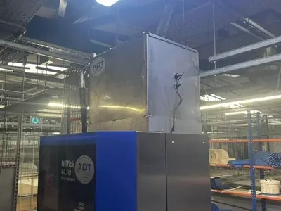 Nilfisk SC Delta multi-pump pressure washer system prior to water tank and system upgrades in a Birmingham food processing factory, before improvements to handle high-demand nightly clean-down usage.